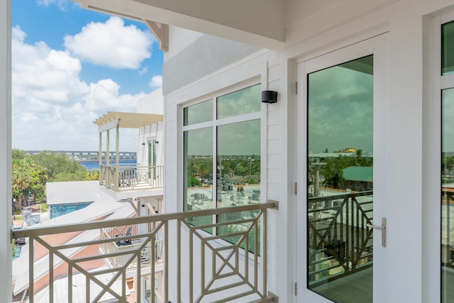 balcony featuring a water view