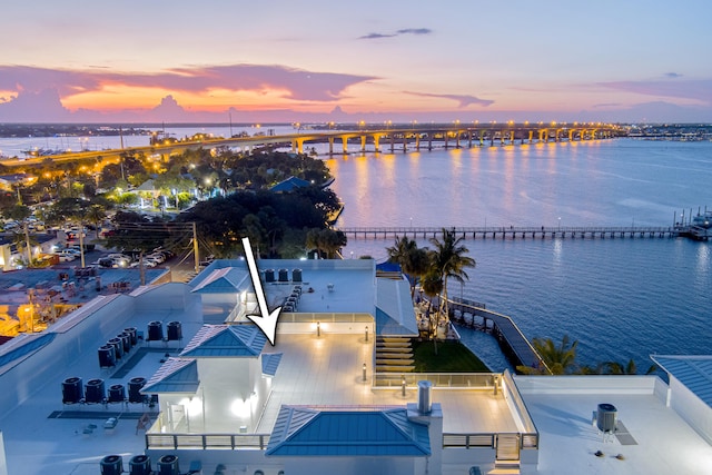 aerial view at dusk with a water view