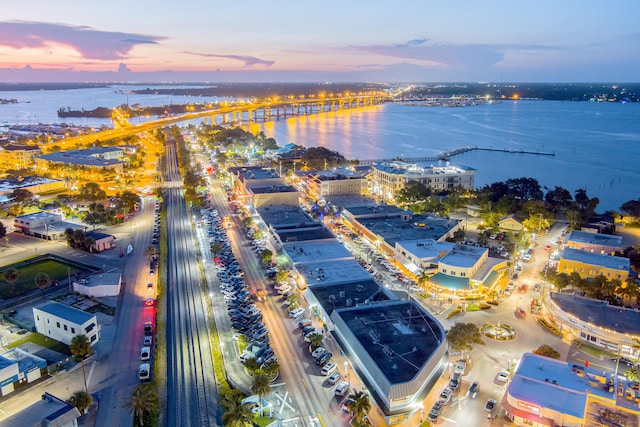 aerial view at dusk with a water view