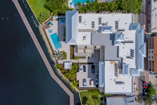 birds eye view of property with a water view