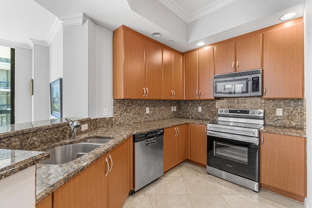 kitchen with sink, dark stone counters, stainless steel appliances, light tile flooring, and tasteful backsplash