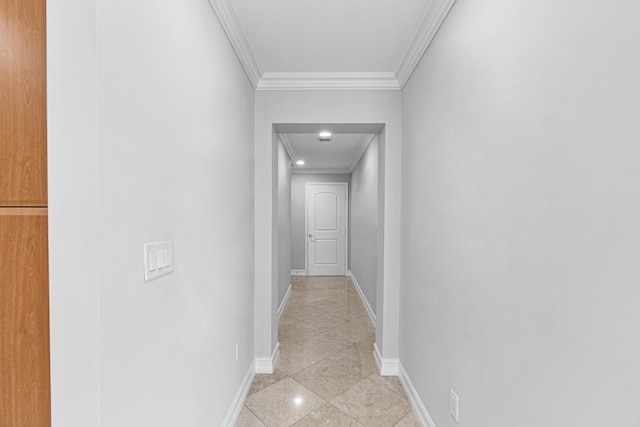 hall featuring ornamental molding and light tile floors