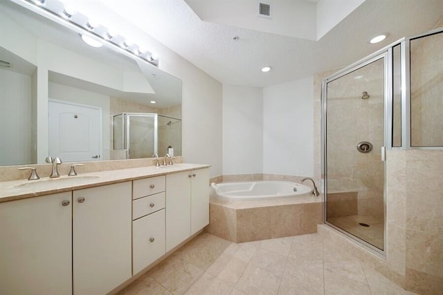 bathroom with oversized vanity, tile flooring, independent shower and bath, and dual sinks