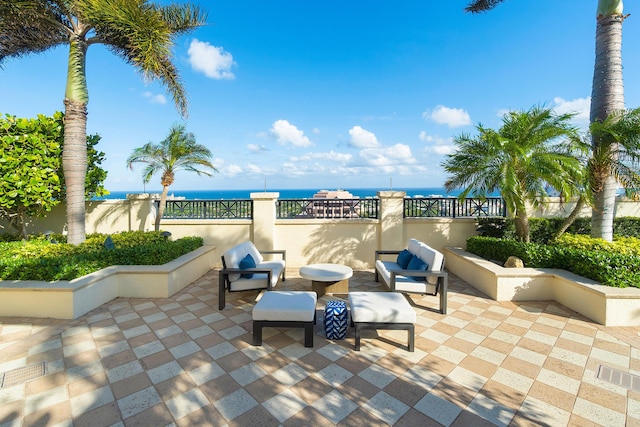 view of terrace with a water view