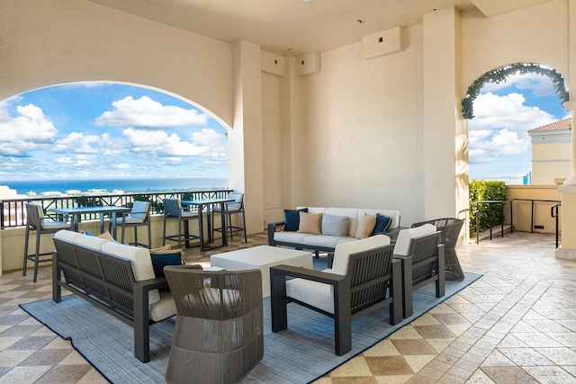 view of terrace featuring outdoor lounge area and a water view