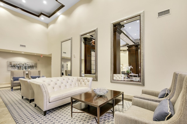 living room featuring a high ceiling