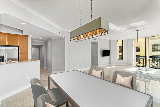 dining room featuring ornamental molding and light tile flooring