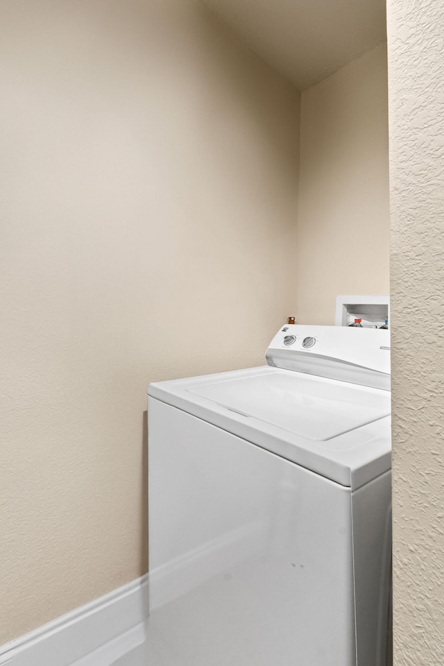 laundry room featuring washer / dryer