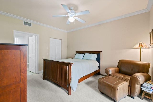 bedroom featuring light carpet, a closet, ceiling fan, and crown molding