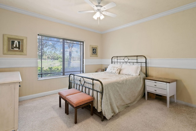 bedroom with light colored carpet, ornamental molding, and ceiling fan