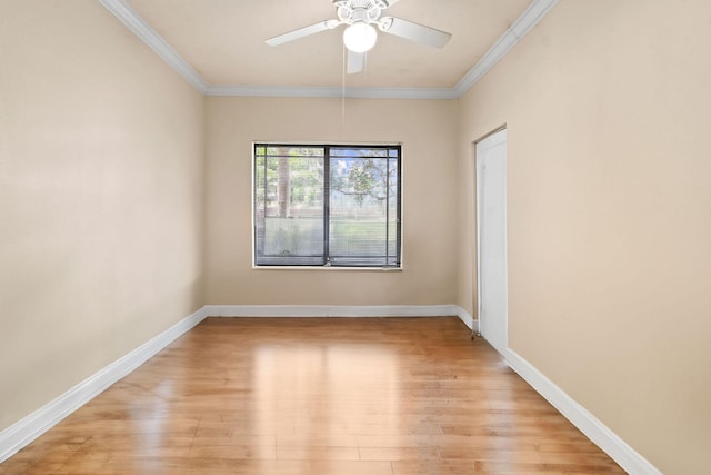 unfurnished room featuring ornamental molding, ceiling fan, and light wood-type flooring