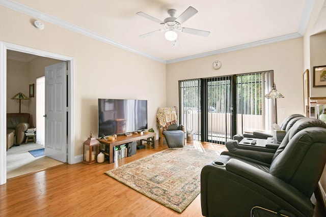 carpeted living room featuring crown molding and ceiling fan