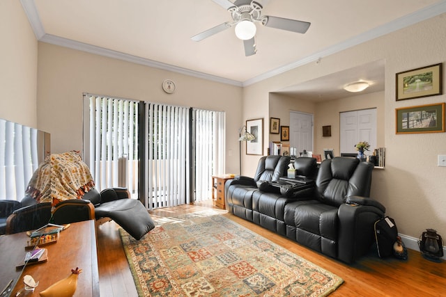 living room with ceiling fan, ornamental molding, and light hardwood / wood-style flooring