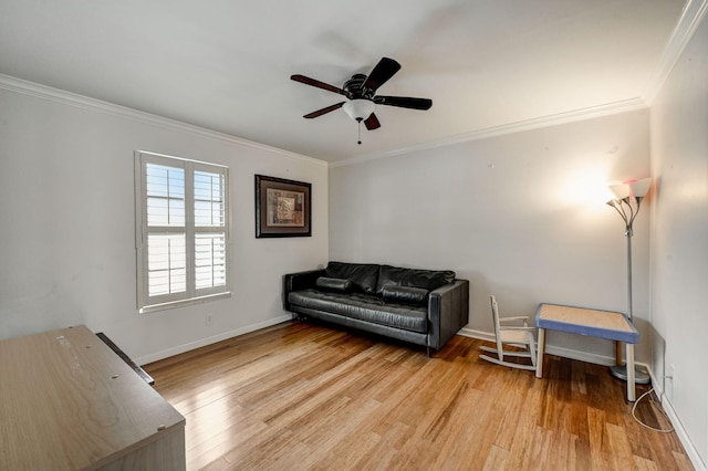 living area featuring crown molding, ceiling fan, and light hardwood / wood-style flooring