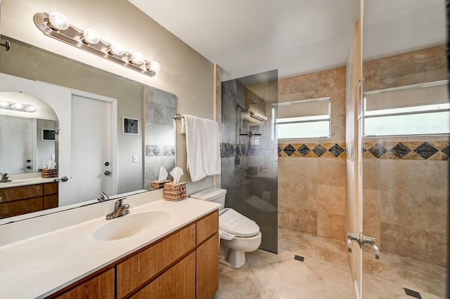 bathroom featuring tile flooring, an enclosed shower, toilet, and large vanity