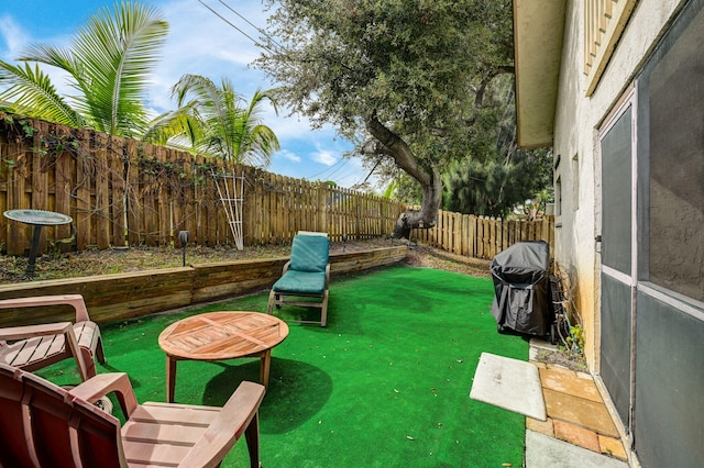 view of patio featuring a grill