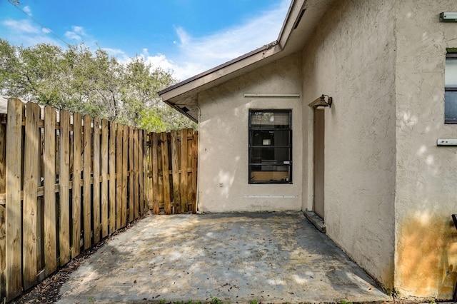 property entrance with a patio area