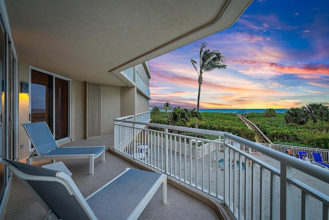 view of balcony at dusk