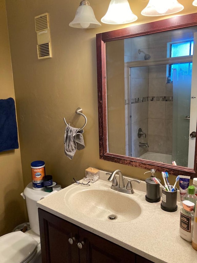 bathroom featuring toilet and oversized vanity