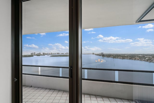 balcony featuring a water view