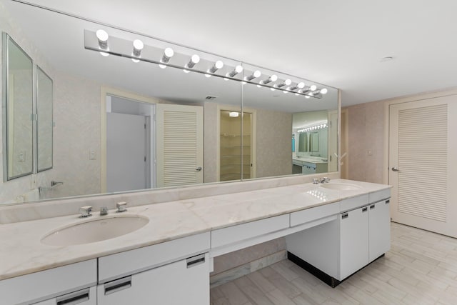 bathroom with wood-type flooring and vanity