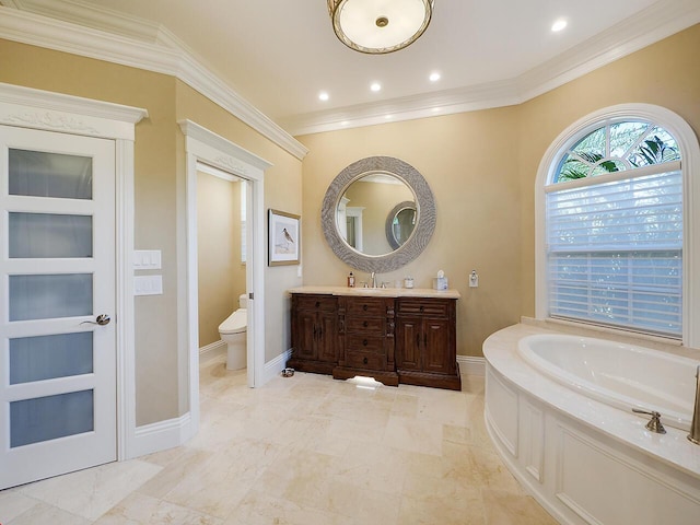 bathroom with crown molding, baseboards, toilet, a bath, and vanity