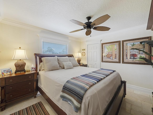 bedroom featuring ceiling fan, crown molding, baseboards, and a textured ceiling