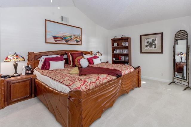 carpeted bedroom with lofted ceiling