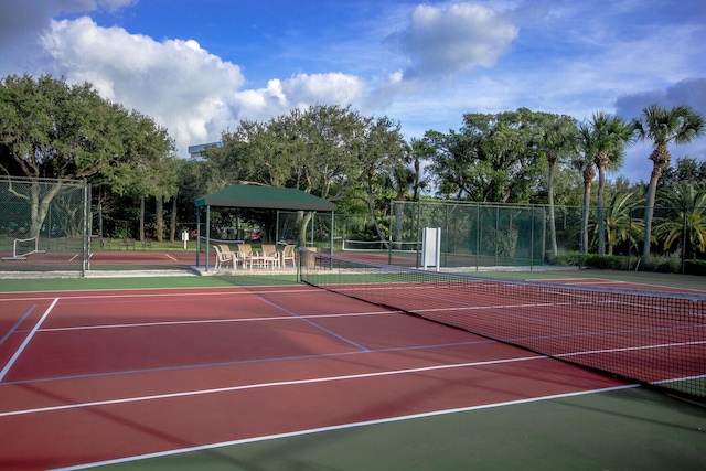 view of tennis court featuring basketball court