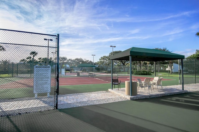 view of property's community featuring a gazebo and tennis court