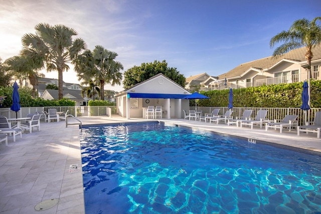 view of swimming pool featuring a patio area