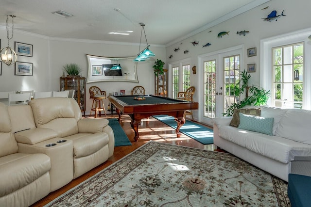 rec room with wood-type flooring, pool table, ornamental molding, and french doors