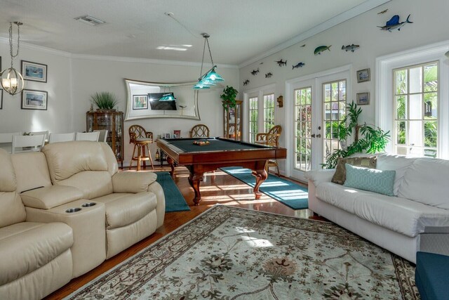 rec room with pool table, ornamental molding, and french doors