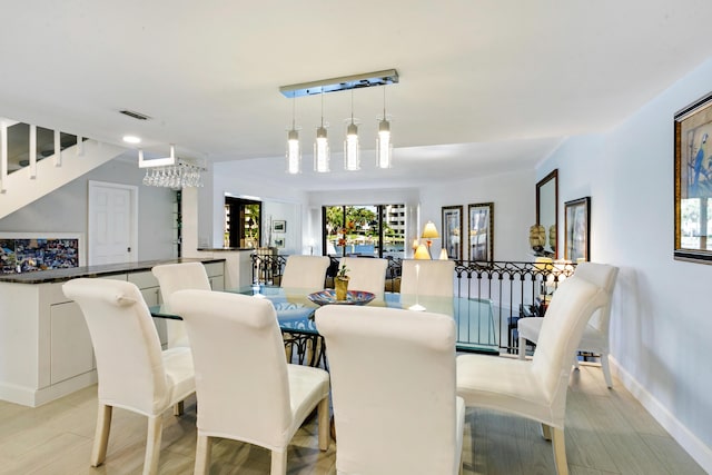 dining space featuring light hardwood / wood-style flooring