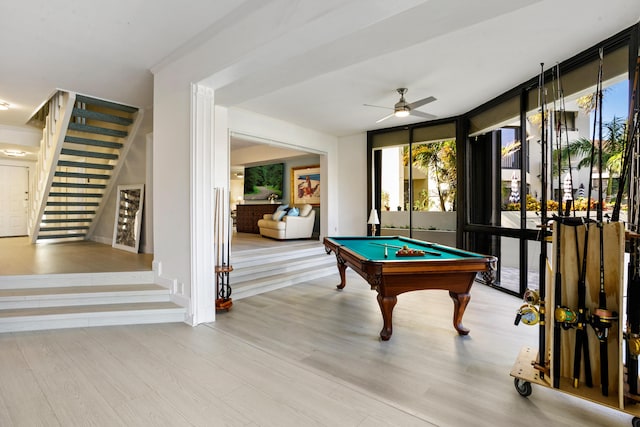 playroom featuring ceiling fan, expansive windows, light wood-type flooring, and billiards