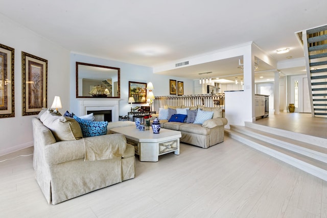 living room featuring crown molding