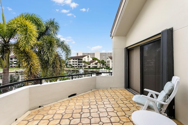 balcony featuring a water view