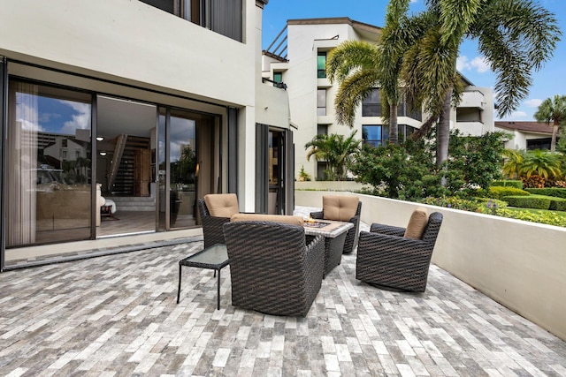 view of patio featuring an outdoor fire pit