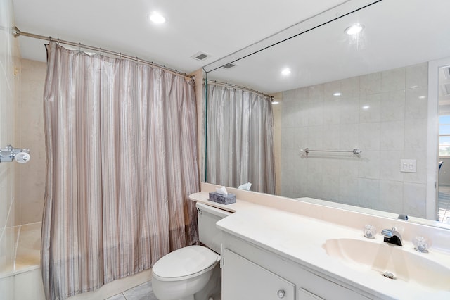 full bathroom featuring shower / tub combo, vanity, tile walls, tile patterned flooring, and toilet