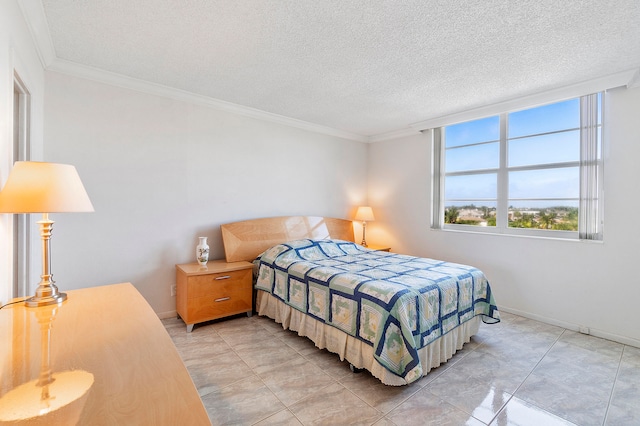 bedroom with crown molding and a textured ceiling