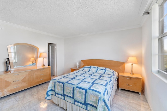 bedroom featuring light tile patterned floors, a textured ceiling, and ornamental molding