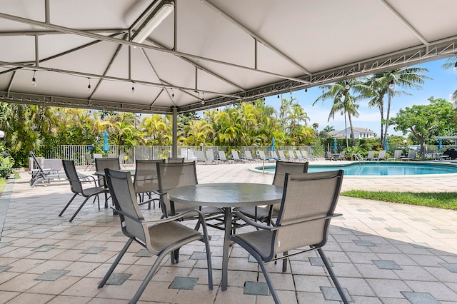 view of patio featuring a community pool