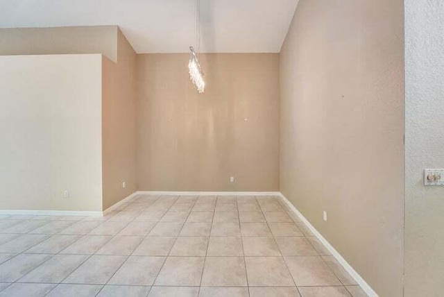 spare room with light tile floors