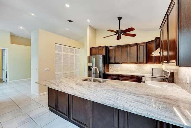 kitchen with ceiling fan, light tile floors, sink, backsplash, and stainless steel refrigerator with ice dispenser