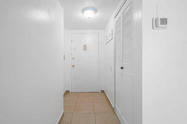 hall with light tile flooring