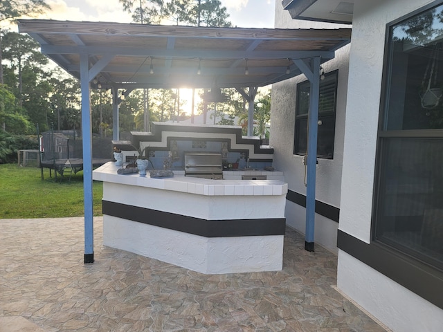 view of patio / terrace with a trampoline and an outdoor hangout area