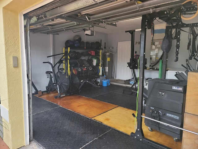 workout room with electric water heater and concrete floors