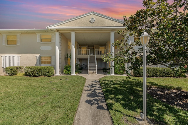 view of front of home with a yard