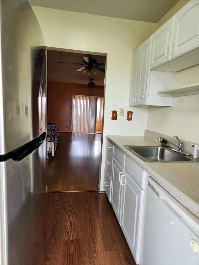 kitchen featuring ceiling fan, dark wood-type flooring, stainless steel refrigerator, dishwasher, and sink