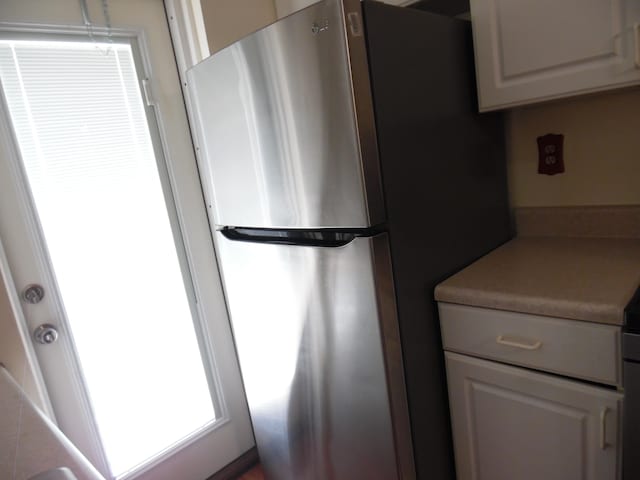 interior details with stainless steel refrigerator